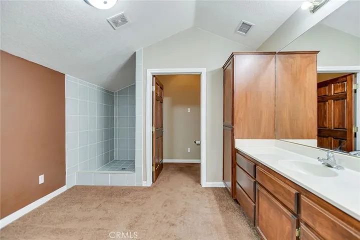 Full bathroom with large closet