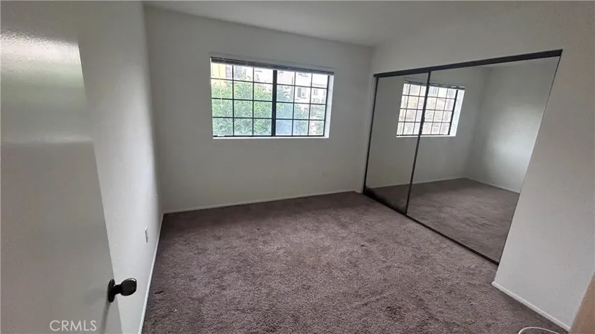 Secondary Bedroom... Lots of light and closet space...