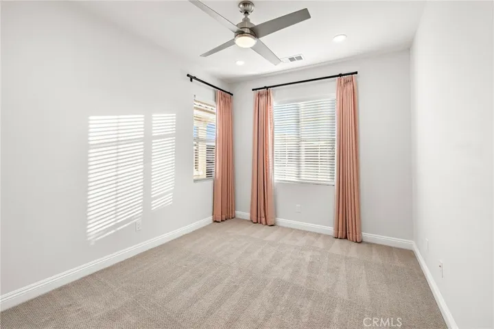 Second-floor bedroom with walk-in closet and private bathroom
