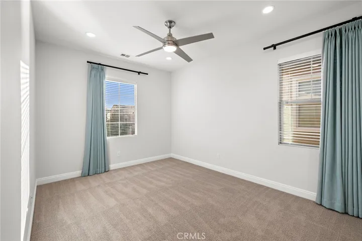 Second-floor bedroom with closet and private bathroom
