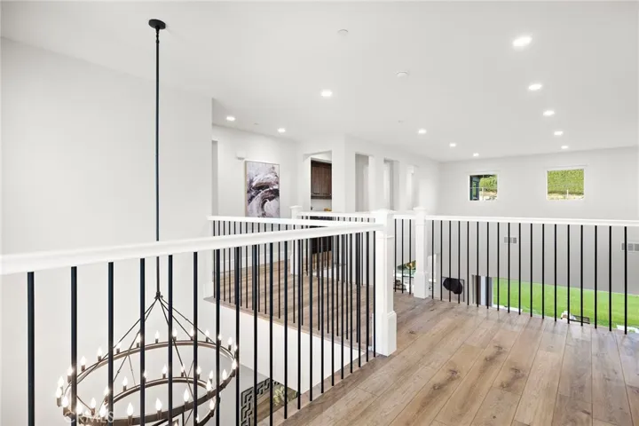 Upper-level hallway linking bedrooms and family room

