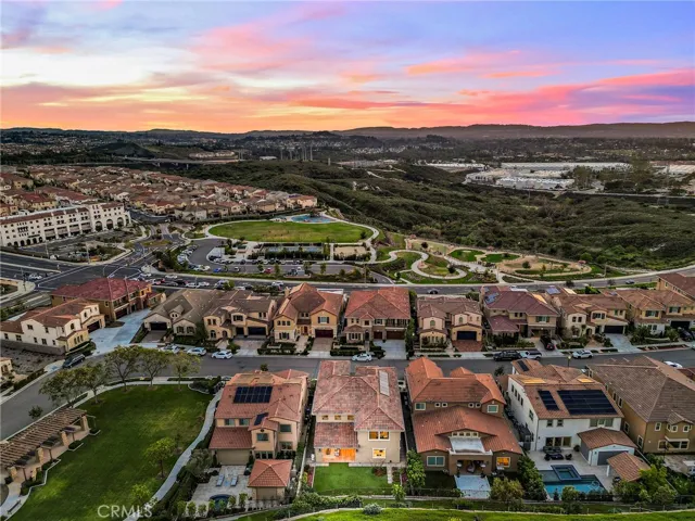 Sunset drone shot showcasing the home and surrounding community
