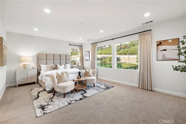 Bedroom perspective showcasing the lush green hillside backdrop
