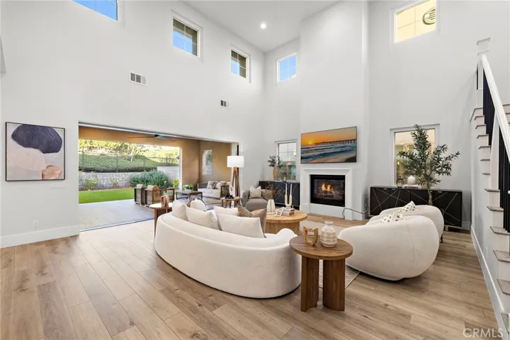 Great room opening to backyard through oversized bifold glass doors

