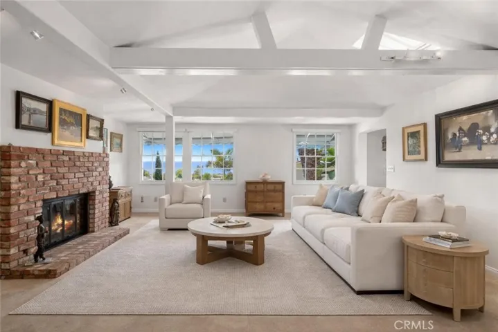The property beautifully combines classic architectural character with modern comforts. Offering four bedrooms and three-and-a-half bathrooms, the flexible floor plan includes a separate entrance to the lower-level rooms, ideal for guests, extended family, or a creative studio space. (Virtually Staged)