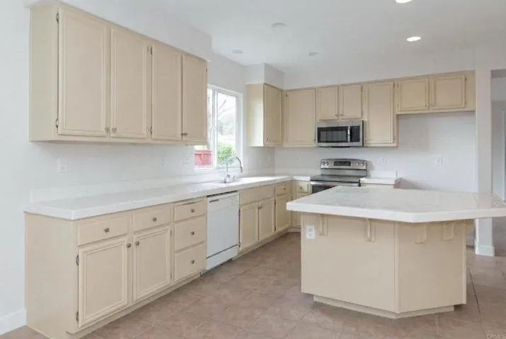 This photo has been digitally altered to add a stove and microwave.