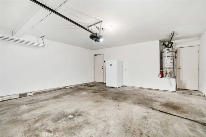 Direct access garage with included freezer.