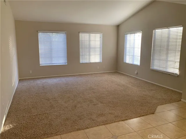 Spacious living room with plenty of natural sunlight