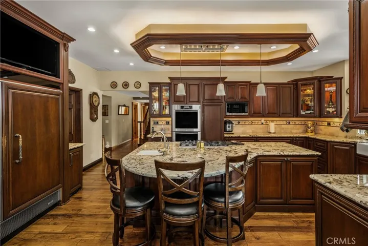 Recessed, in and under cabinet lighting and kickplate lighting, Miele double oven with warming drawer, Kitchenaide dishwasher with panel doors, deep drawers and pull out cabinets