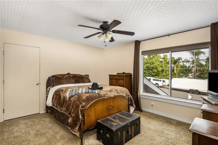 Bedroom upstairs at the end of the hall-has access to attic for storage