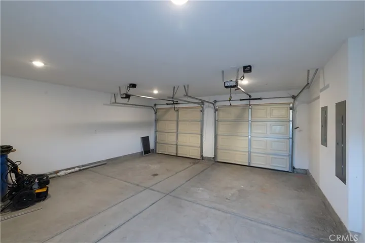 View of garage. Unit A takes 1 spot in garage plus driveway space directly behind.