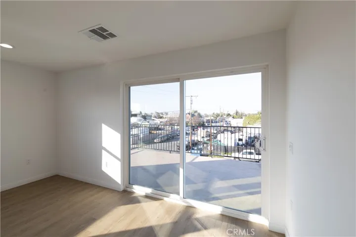 Sliding glass door leading to large balcony