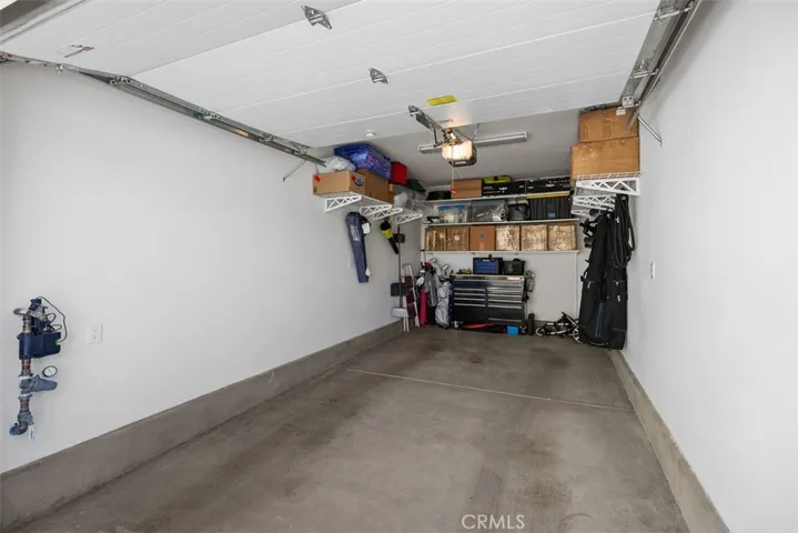 Garage has plenty of room for storage and car.