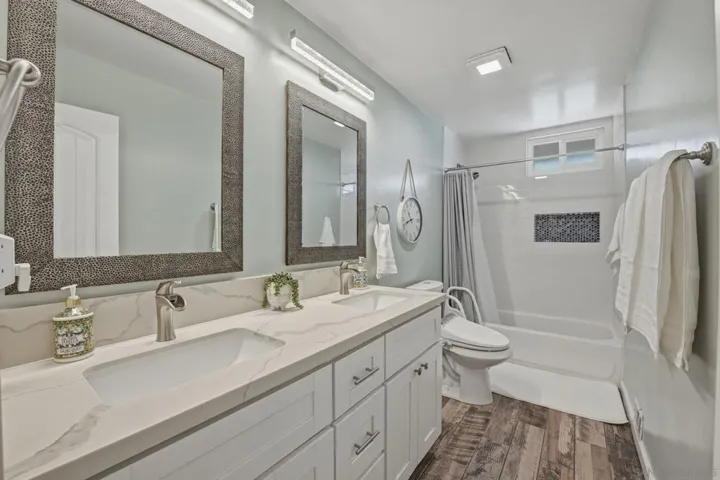 Hall bath with double sinks, beautiful tile and bidet with heated seat