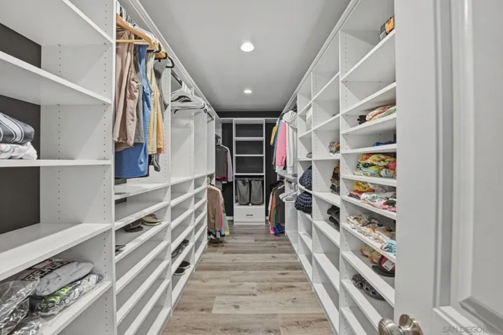 Primary bedroom has huge, new closet system from The Tailored Closet