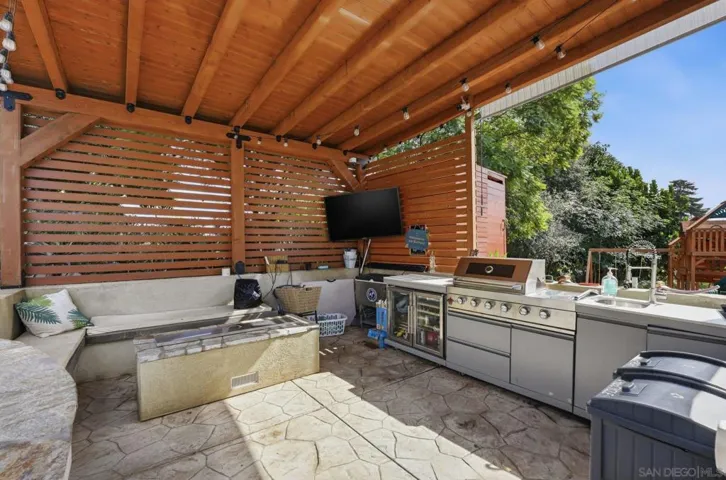 Outdoor kitchen with gas grill and gas fire table