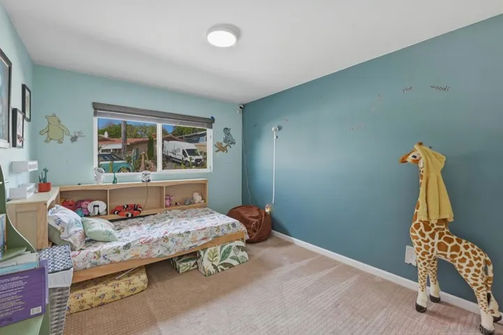 3rd bedroom, facing front yard, walk-in closet