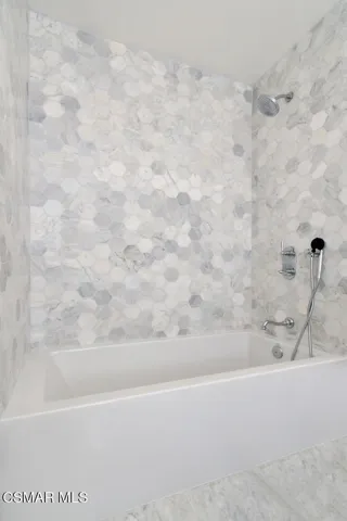 Bath tub with shower head and wand