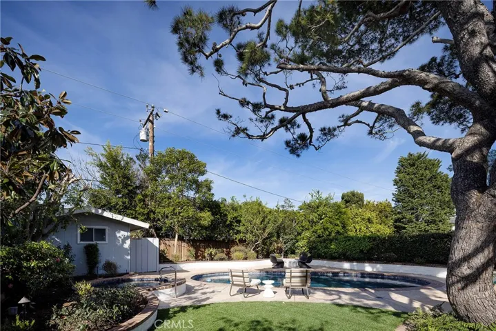 Spacious 9,123 sq ft lot with pool, spa, pool cabana with 3/4 bath and mature tree