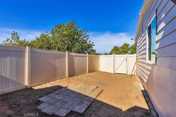 Vinyl fencing in back yard.  New exterior paint on home.