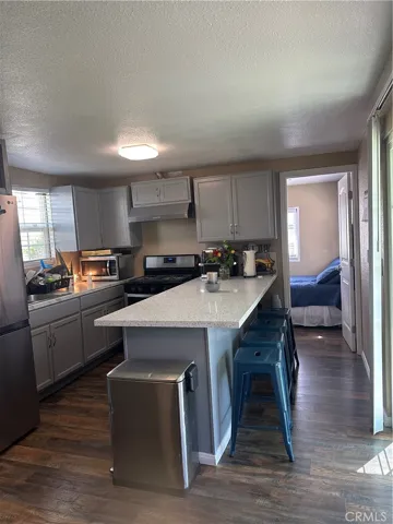 view to the kitchen and 2nd bedroom