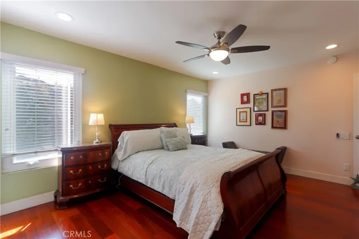Large primary bedroom with view to backyard.
