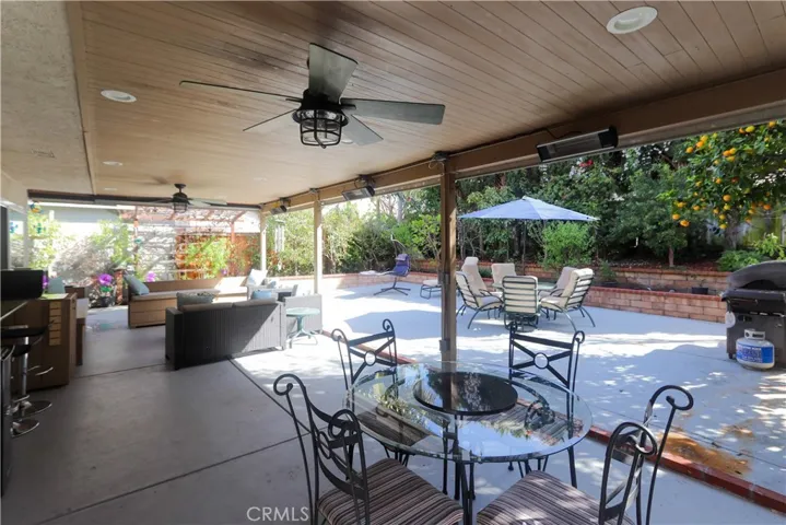 Spacious covered outdoor living area designed for true California living! Complete with fans, heaters, and remote sun shades.