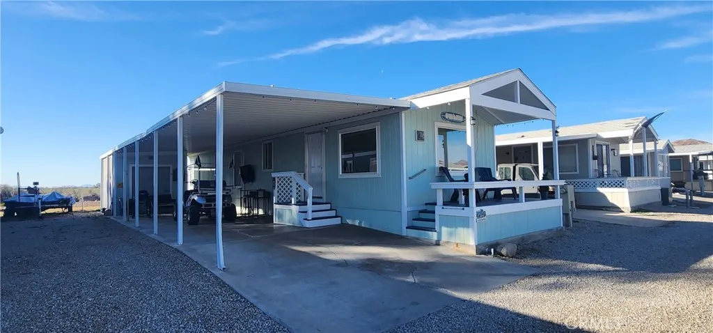 East side of house with covered carport