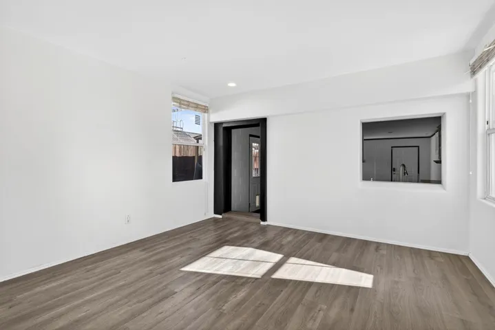 Spare room featuring wood finished floors and recessed lighting