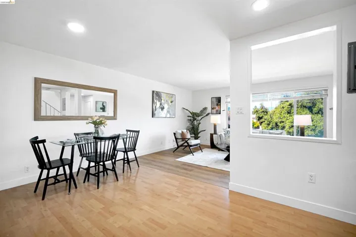 Dining space featuring light wood-type flooring and recessed lighting