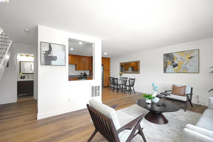 Living room featuring wood finished floors and recessed lighting