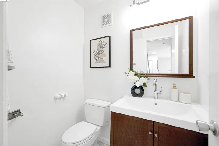 Half bath featuring vanity and toilet