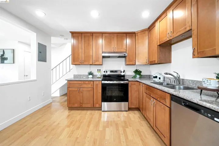 Kitchen with wood finish cabinets, stainless steel appliances, and recessed lighting