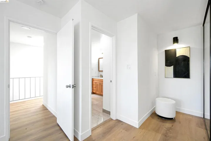 Hallway featuring light wood-style flooring