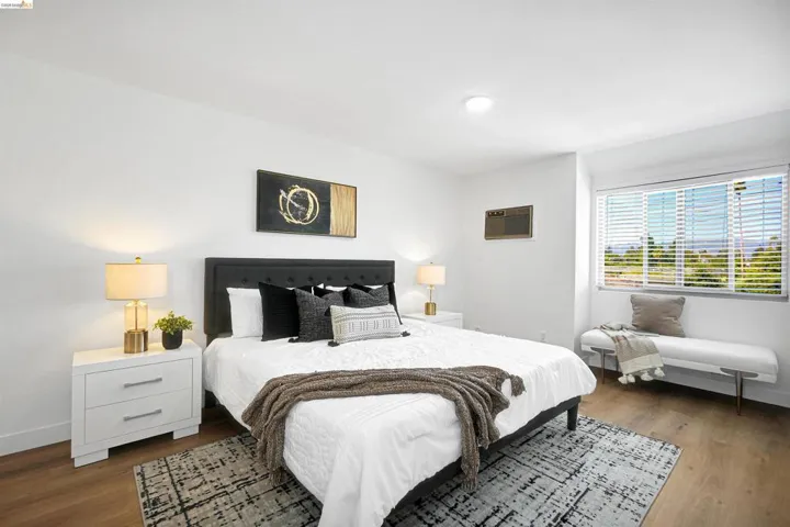 Bedroom featuring dark wood-type flooring