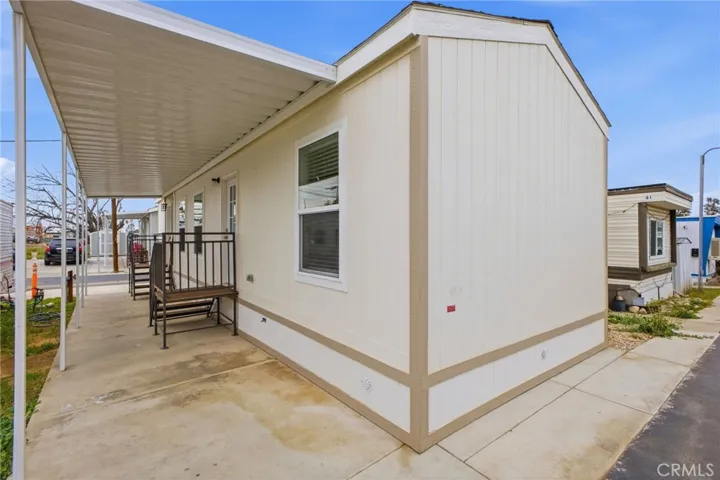 View of back of home and backdoor