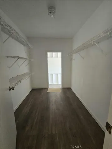 Master closet, door leads to attached garage.