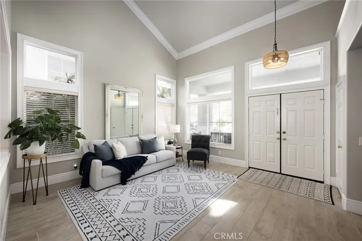 The living room features a vaulted ceiling that creates an open and inviting feel.