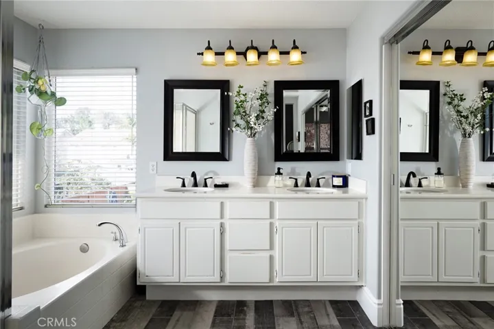 The primary bath features a dual vanity and walk in closet.