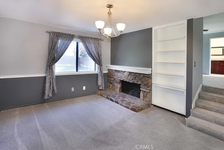 Primary retreat features a separate lounge area with fireplace