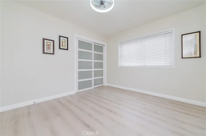Room 2 (downstairs)- Frosted glass, white MDF wood sliding closet doors, laminated wood floorings with new baseboards