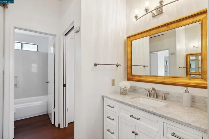 Split Bathroom with Shower Over Tub Combo