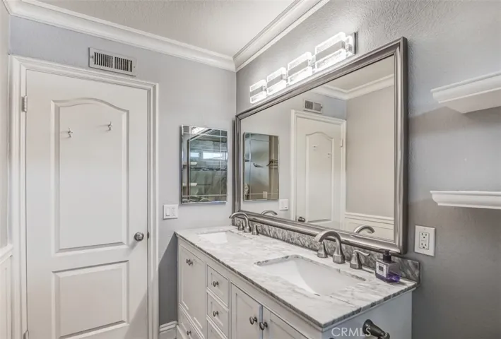 Vanity offers two sinks & quartz counters