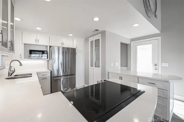 Stainless steel appliances, pantry, quartz kitchen counters