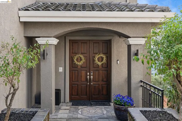 Doorway to property with stucco siding
