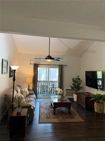 Living Room with tall ceiling and ceiling fan
