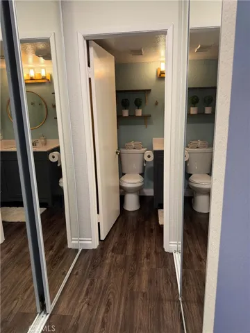 Mirrored closet doors in  master with view of ensuite bathroom