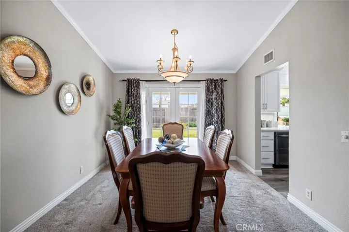 dining area with French door adding light and access