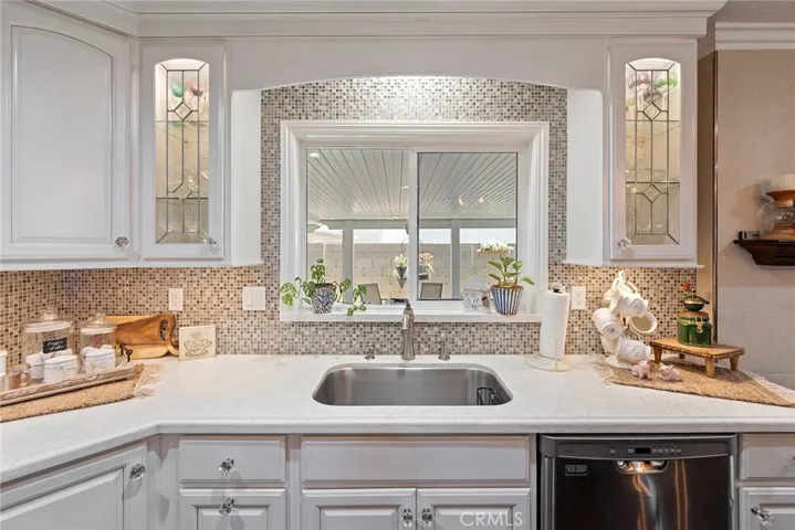 Designer backsplash, and glass cabinetry
