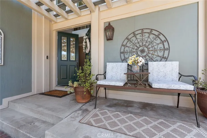 Inviting front porch to sit and enjoy a cup of morning coffee